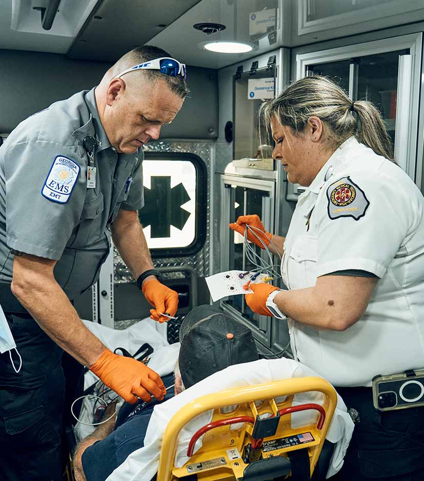 EMTs administering care to a patient.